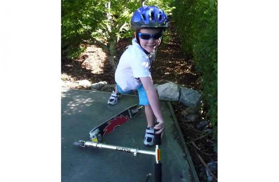 Crikey . . . Harvey Pringle (5), of Australia, tries out a new scooter at his grandparents' home...