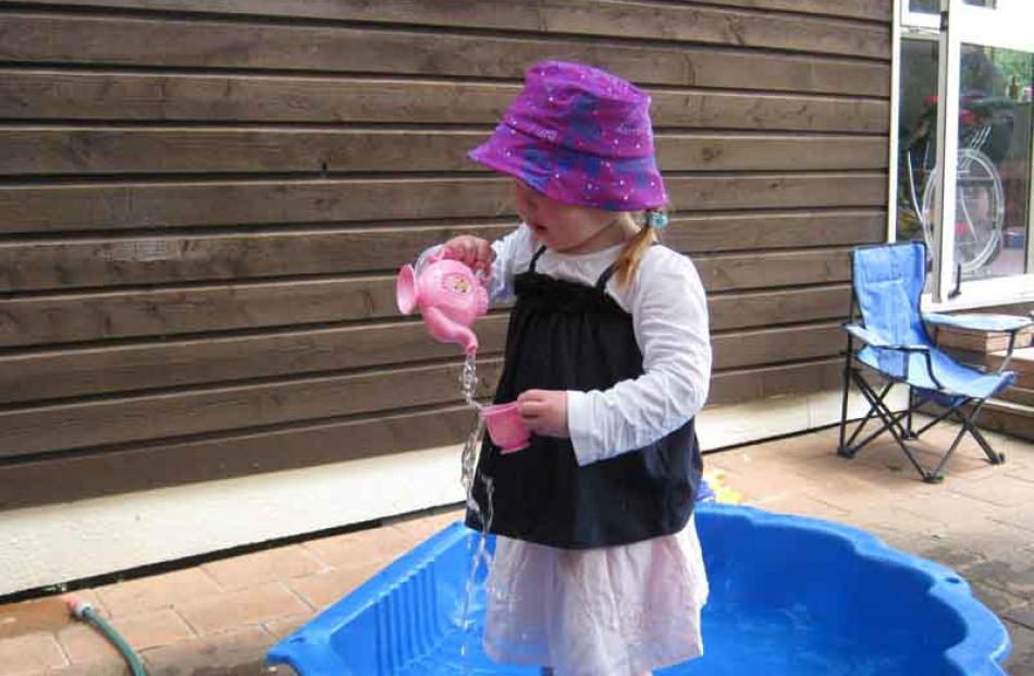 Time for a cuppa . . . Sophia Owers (2) enjoys her new tea set on Christmas Day. Photo: Fiona Owens