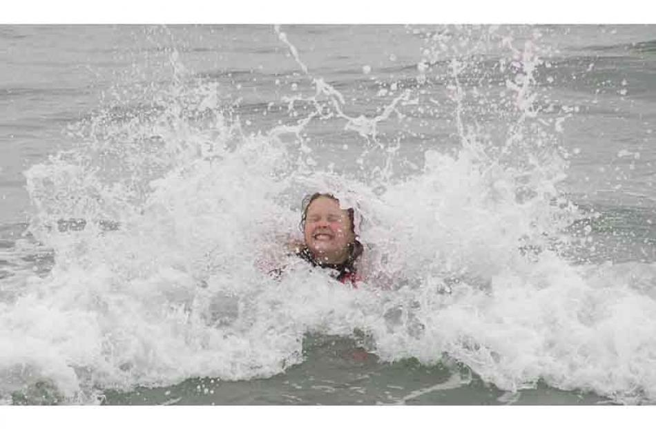 Emily Paterson (10) enjoying the waves at Brighton Beach. Credit: Glenda Paterson.