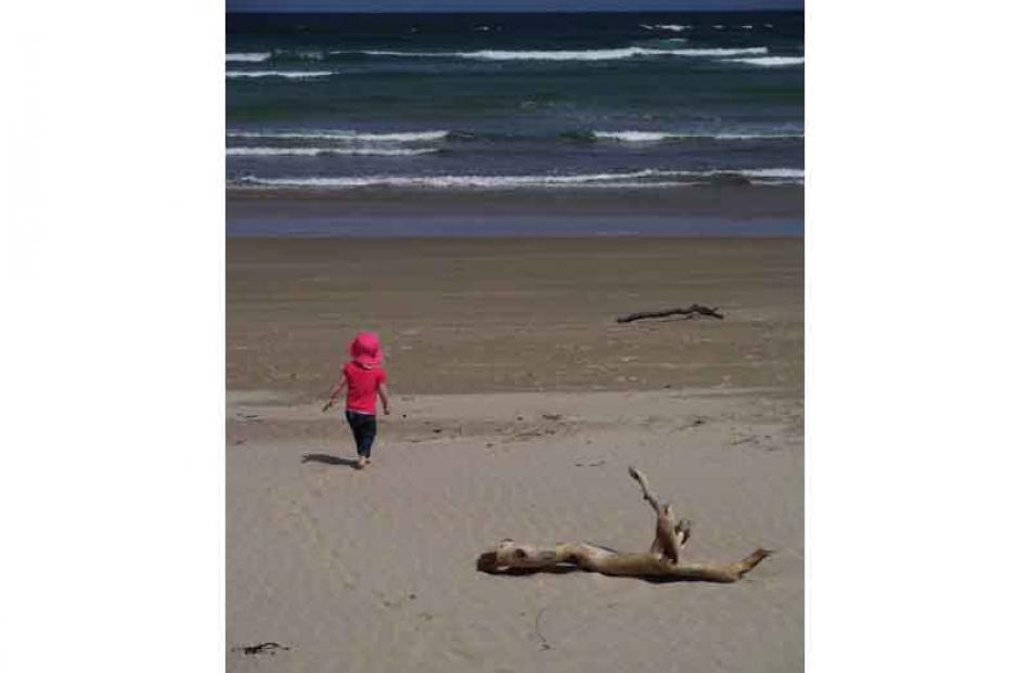 Anniversary . . . Carolena Booth (2) on Surat beach after a New Year's Day picnic. Three...