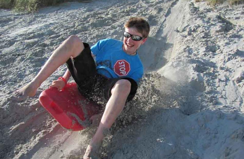 This is my brother Jack Verhoef (11) having fun sand boarding at Smaill's beach. photo: Shanna...