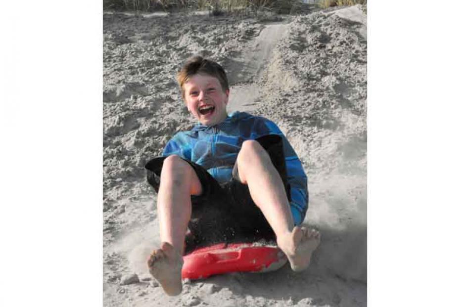 This is my son Jack Verhoef (11) enjoying sand boarding at Smaill's beach. Photo: Kathy Richards