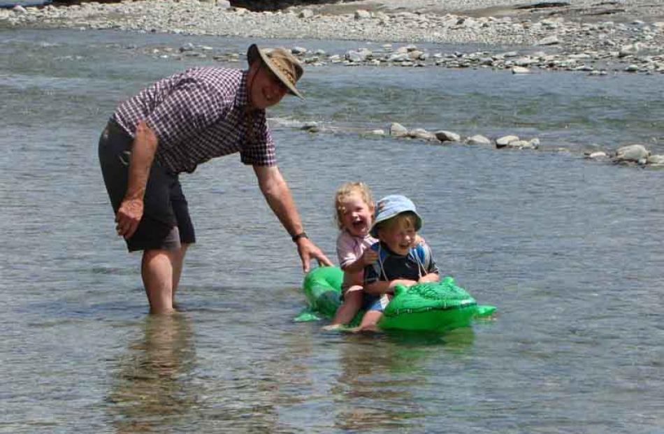 Wayne Olsen ( Dunedin ) enjoying a break away in Otematata with twin grandchildren Danny and...