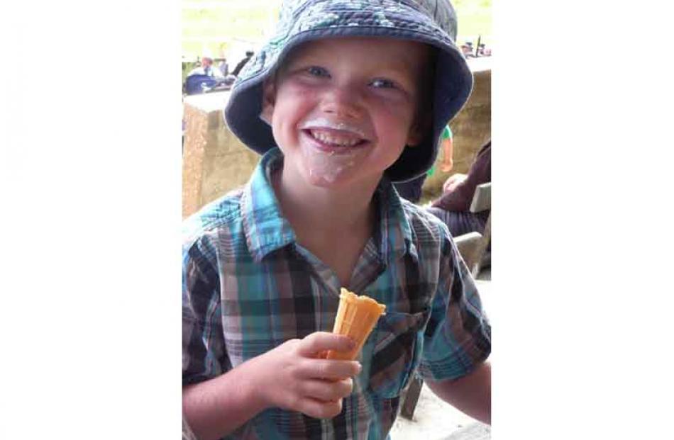 Harvey Pringle (5) enjoys icecream at the Waikouaiti Races. Credit: Lois Davis,