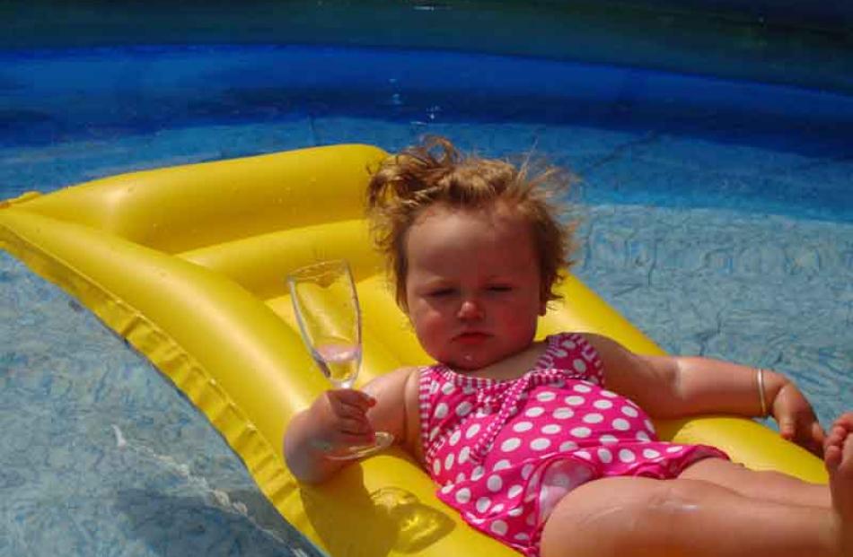 Cool in the pool . . . Jorja Woodford (18 months) at home in Westwood. Photo: Rachel Turner