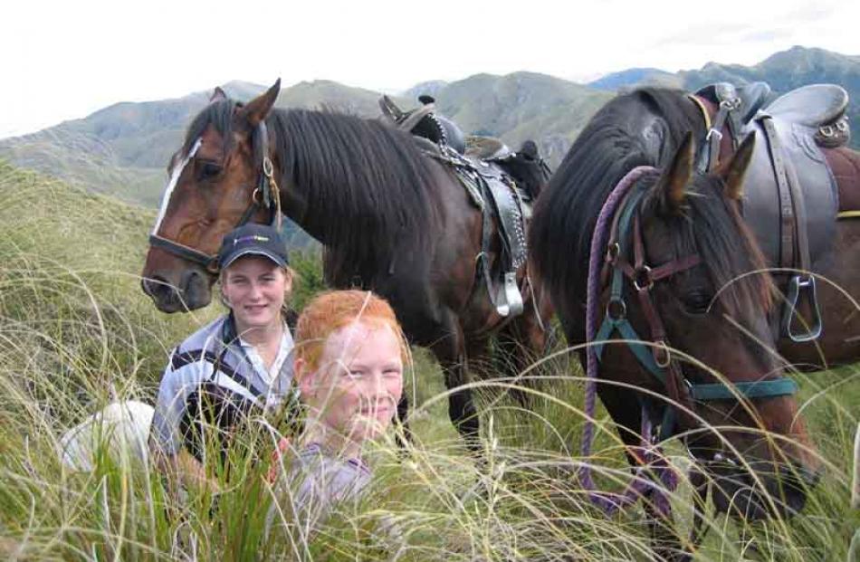 mmIMG_5052.JPG Lunch break . . . Micayla Brenssell, of Dunback, (left) with horse Ronnie and...
