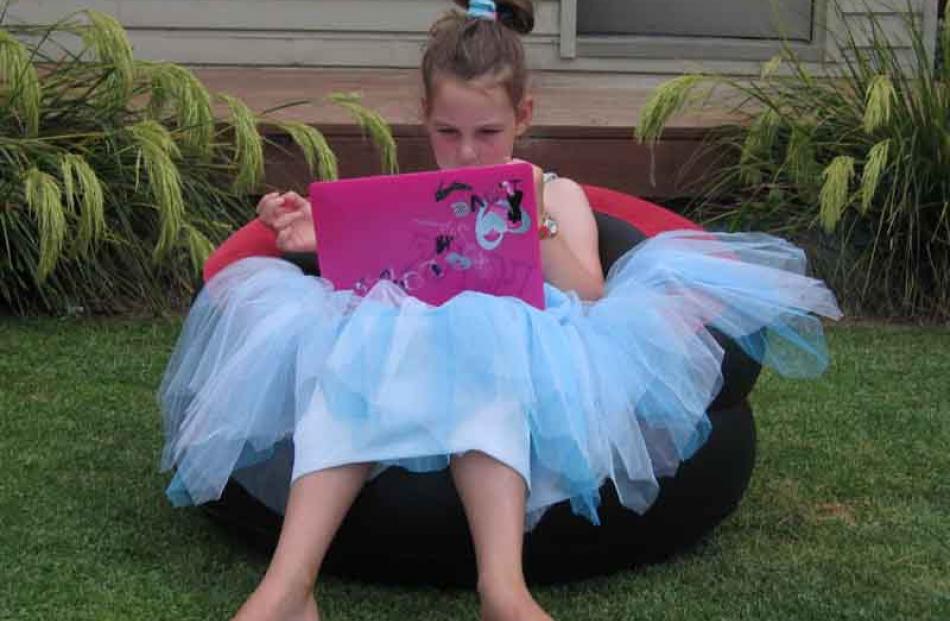 Technological concentration... Lilly Parke (Auckland) with her new laptop she got on Christmas...