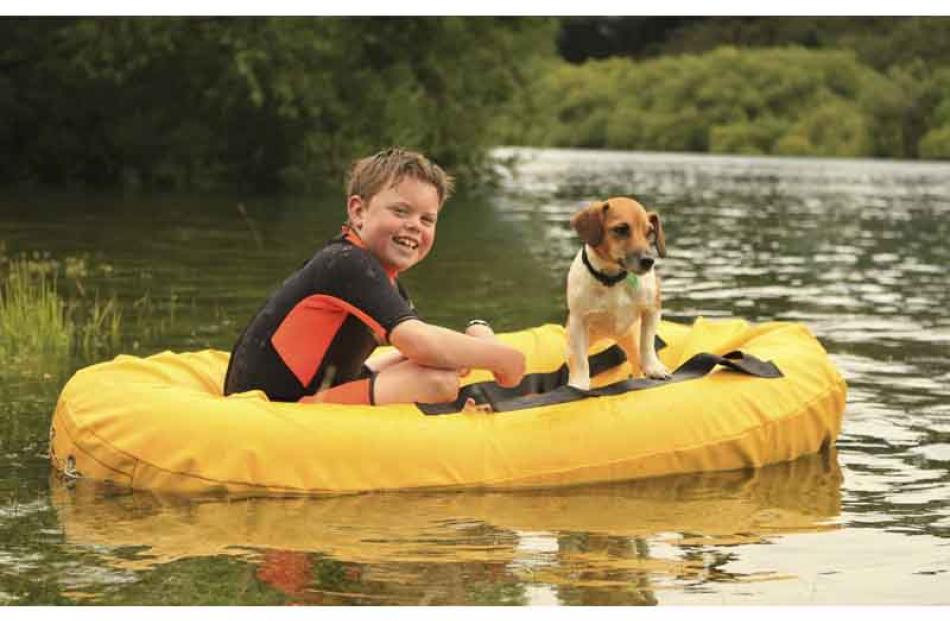WINNING PHOTO . . . Ayden Boyd (10) and dog Jimmy on the Kawarau River. Photo: Jo Boyd