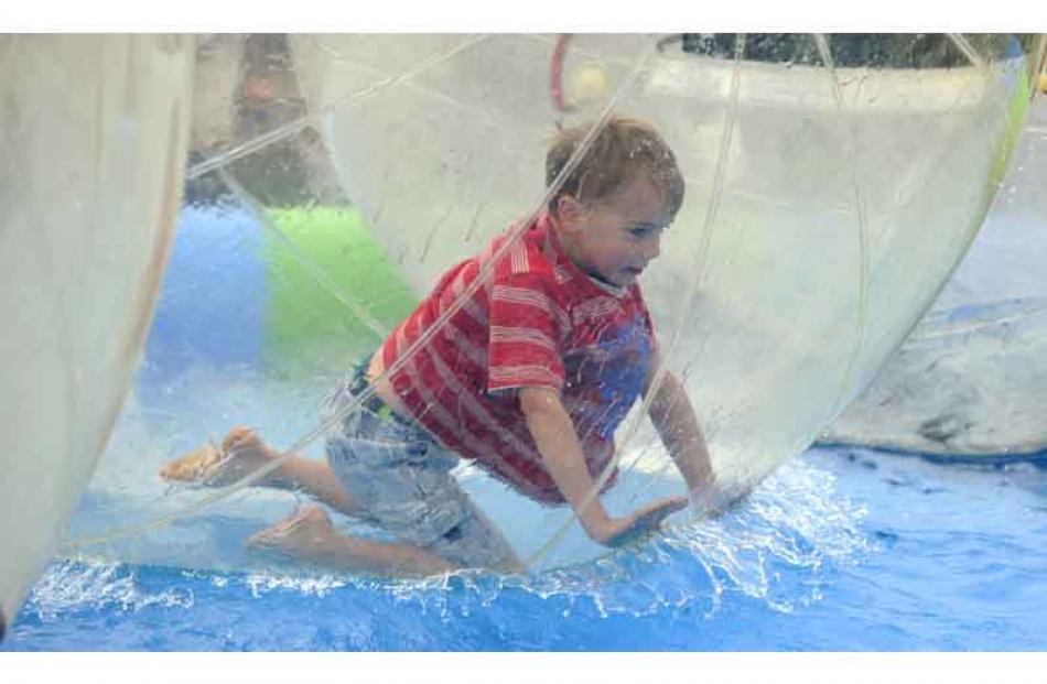 Jack Henderson (5), of North Taieri, goes for a spin in an inflatable ball in a paddling pool.