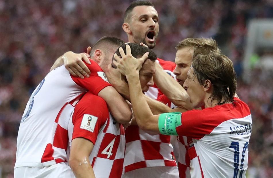  Croatia's Ivan Perisic celebrates scoring their first goal with team mates. Photo: Reuters