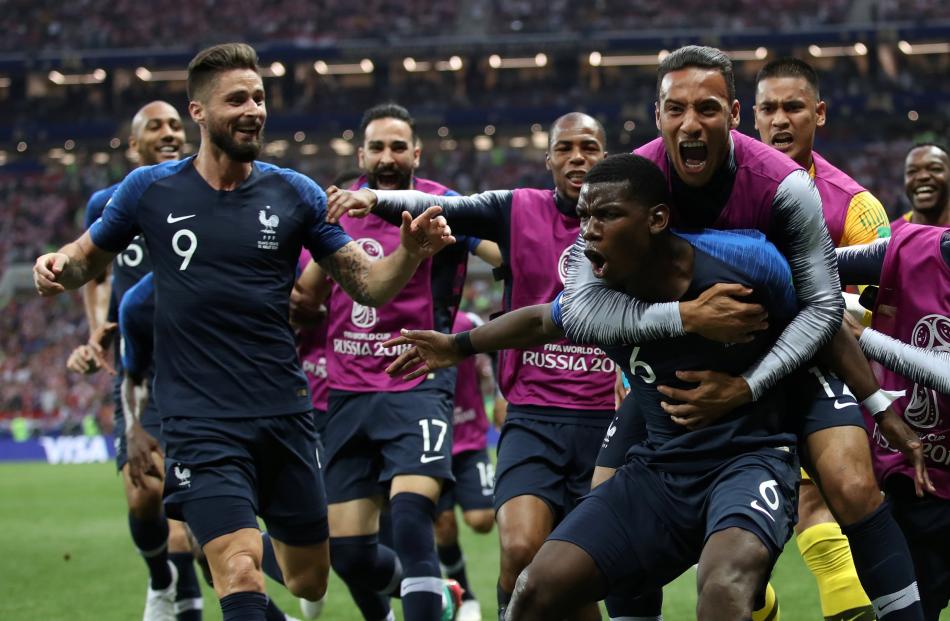 France's Paul Pogba celebrates scoring their third goal with team mates. Photo: Reuters