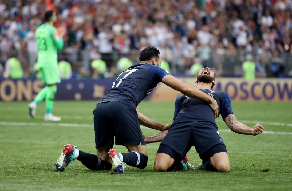 France's Olivier Giroud and Adil Rami celebrate winning the World Cup. Photo: Reuters