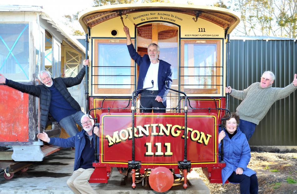 Celebrating the delivery of cable cars to Mornington earlier this year were (from left) Trevor Goudie, Mac Gardner, Neville Jemmett, Claire Goudie and Stuart Payne. Photo:  Christine O'Connor