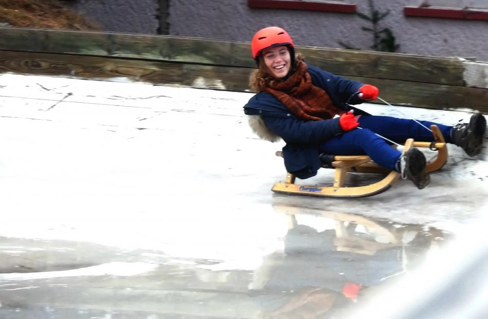 Tres bien! Marine Fossier, of France, enjoys the luge as part of her time as an exchange student...