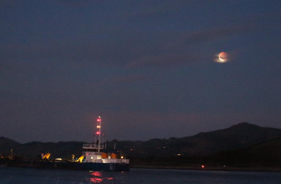 Eclipse seen from a boat heading out of Otago Harbour. Photo: Grant Godbaz