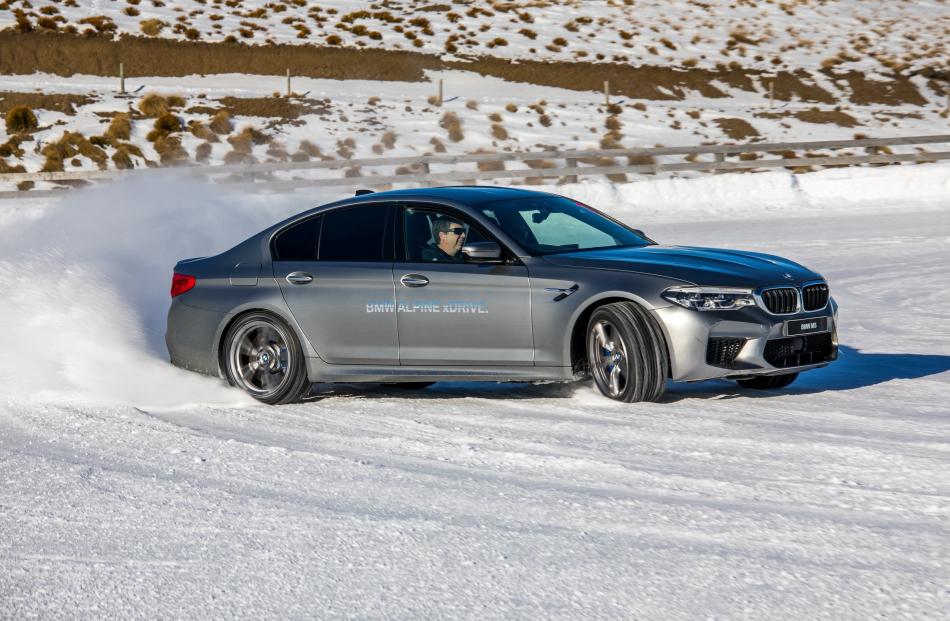Who wouldn’t smile drifting the mighty BMW M5 on snow.