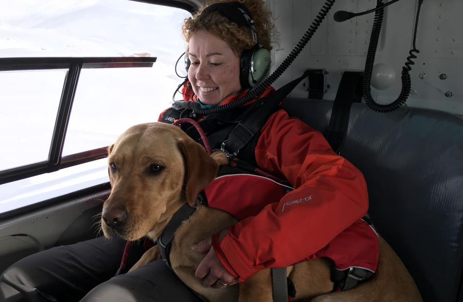 Vladka Kennett keeps an eye on Zara as she gets used to the helicopter.