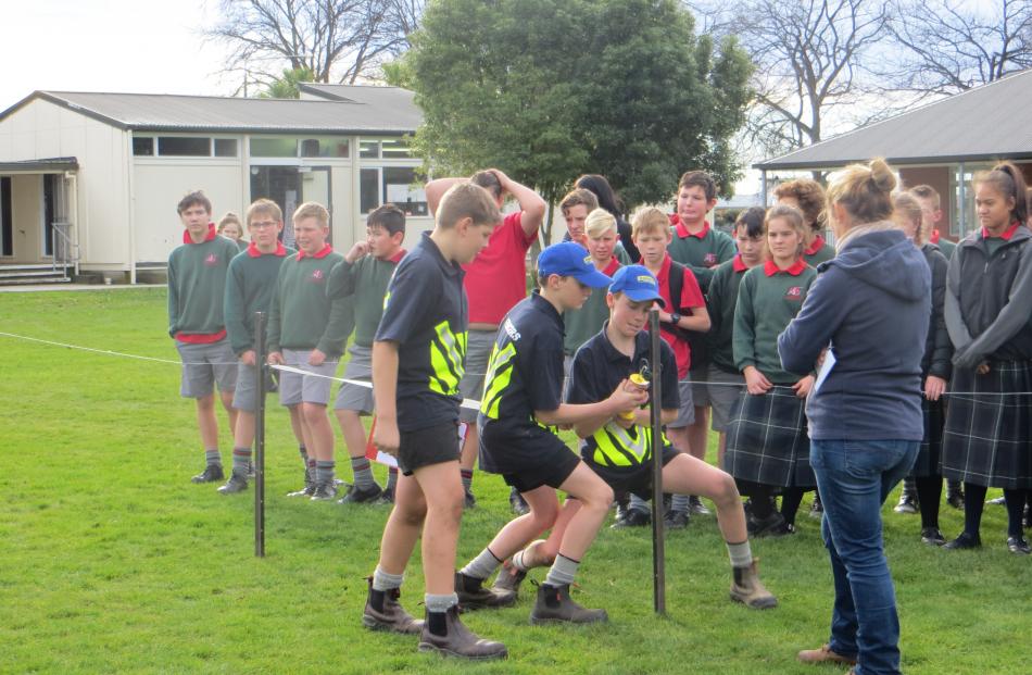 The boys complete a tape gate set up mid-way through the agri-challenge.