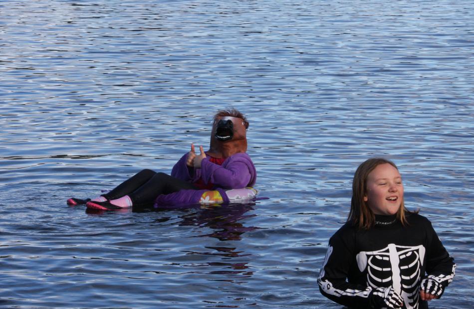 Lily Newcombe and Ruby Hefford take a second dip after the Polar Plunge. 