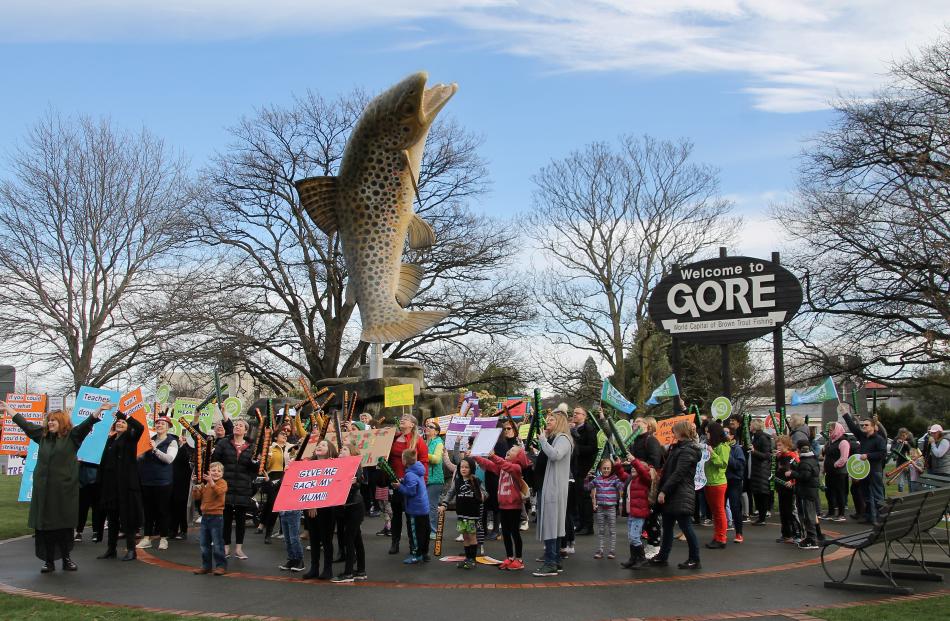 Teachers strike near the Gore sign at the centre of the town today. Photo: Ashleigh Martin