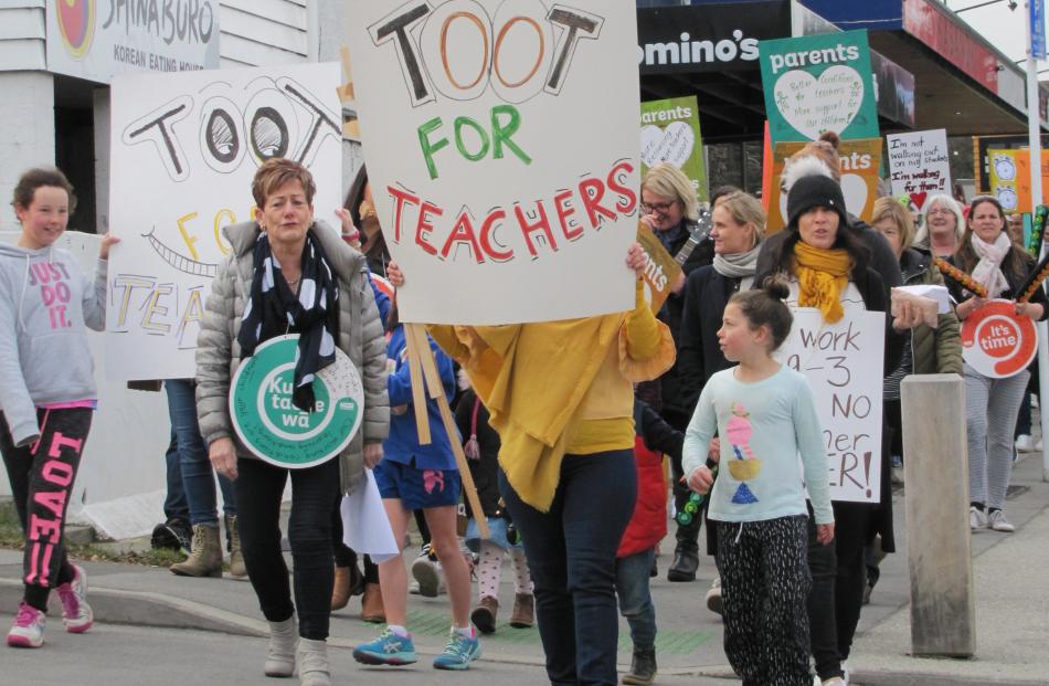 About 150 adults and children, led by Wanaka Primary School principal Wendy Bamford, marched through the main street of Wanaka at 11.30am today in support of the primary teachers' strike.  Photo: Mark Price