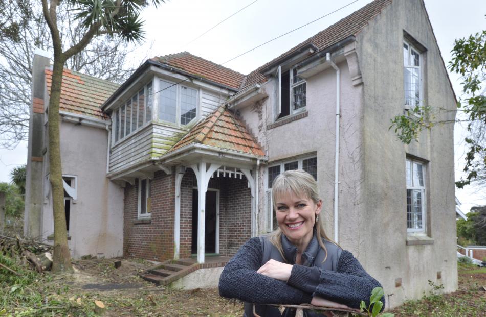 Melanie Kerr takes a breather outside the Tolcarne Ave home she is renovating. Photos: Gerard O...