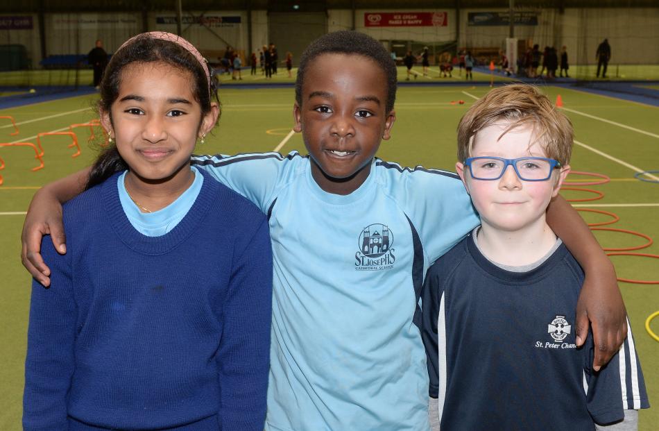 Serah Joby (8) and Fola Shittu (7), of St Joseph’s Cathedral School, and Sam Peters (7), of St...