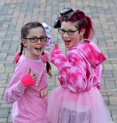 Hollie McDonnell (10, left) and Amelia Nicholson (11), both of Alexandra, are decked out in pink...