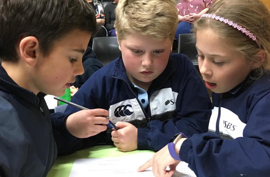 Maniototo Area School year 5 pupils (from left) Charlie Hore (9), Lachlan Mackenzie (9) and Vanessa Paterson (10) concentrate during the year 5-6 section.