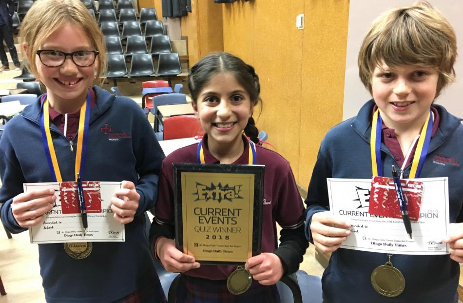 The winners of the year 5-6 Otago Daily Times Extra! current events quiz in Cromwell last night (from left), year 6 pupils Olivia Huddleston (11), Ania-Kanu Saklani (10) and Oscar Crowe (10), of Holy Family Catholic School, in Wanaka, celebrate their succ
