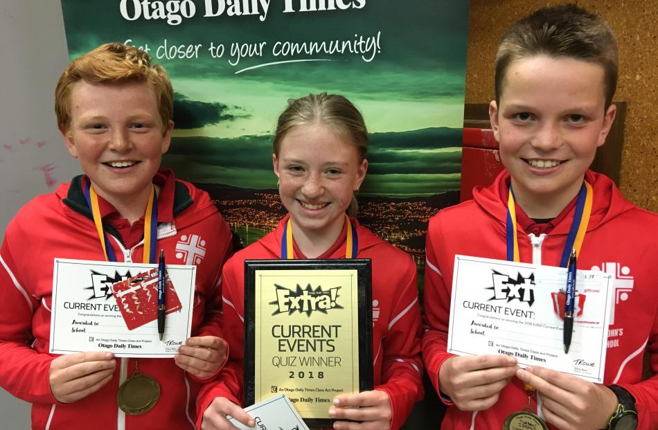 Winners of the year 7-8 Extra! current events quiz (from left) Freddie Hore (12), Maia Macdonald (12) and Jock Duncan (11), all in year 7, at St John's School, in Ranfurly, show off their certificates and medals.