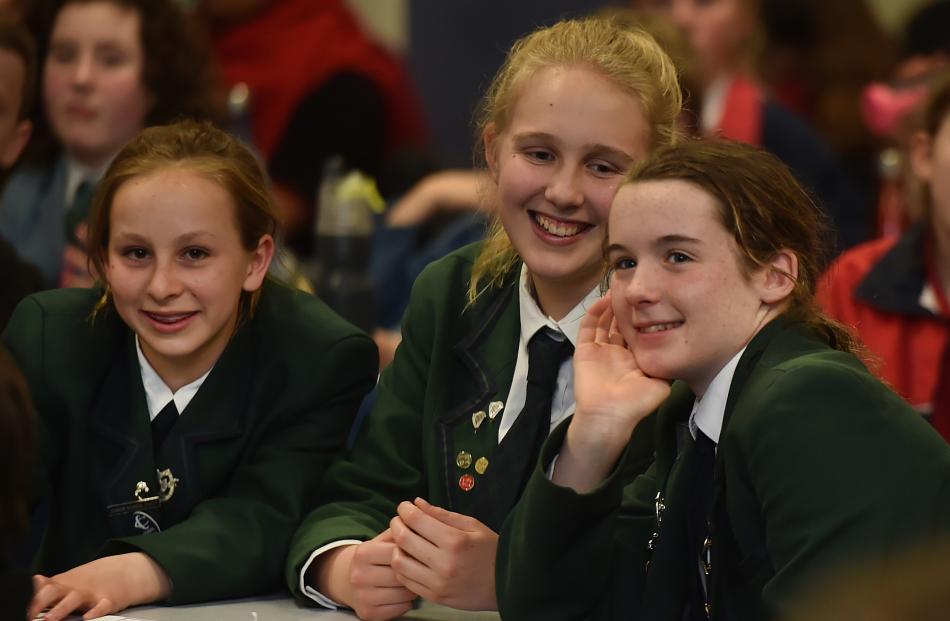 Poppy Henderson (13), Skyla Murray (12) and Catherine Lund (12), of Columba College, take part in the year 7 and 8 quiz.