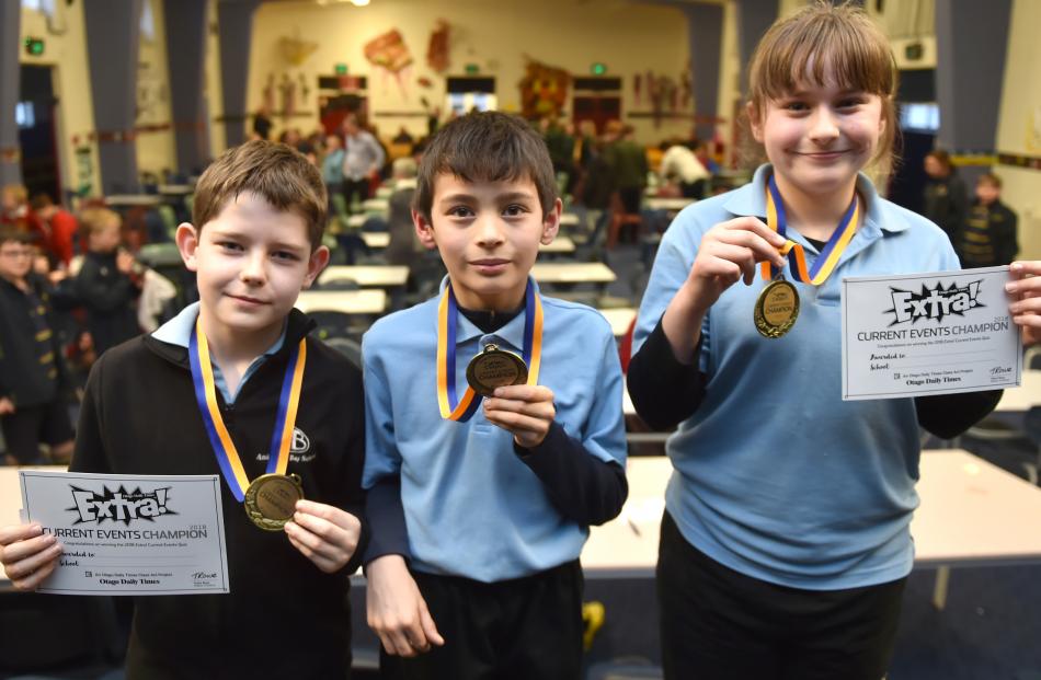 Anderson’s Bay School pupils Oliver Grubb, Aidan Blakie and Tegen Baldwin celebrate their win in the Otago Daily Times Extra! Otago years 5 and 6 current events quiz yesterday. 