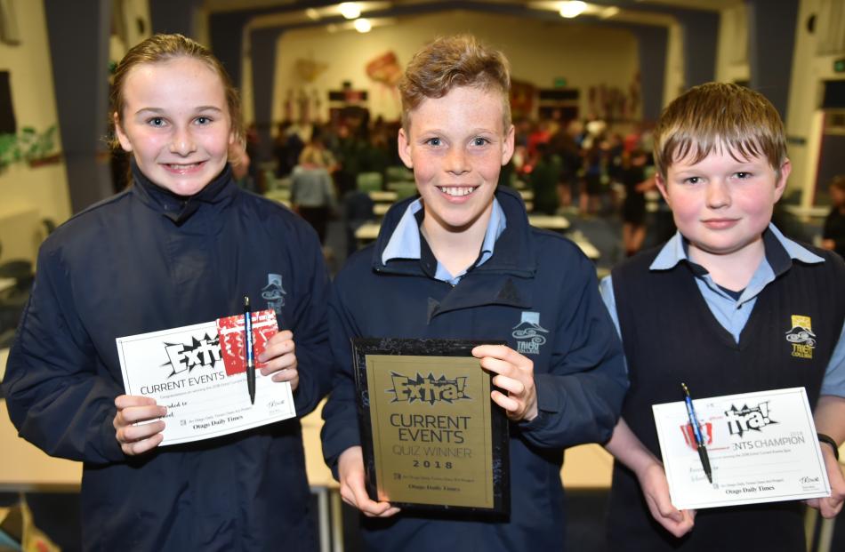 Taieri College pupils Emily Evans, Tom Cunningham and Caden Anderson show off the certificates they won in the years 7 and 8 current events quiz last night.
