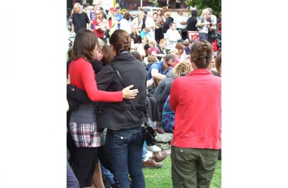 Friends comfort each other after the Kia Kaha Christchurch event. Photo by Joe Dodgshun.