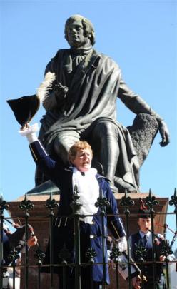 Invercargill town crier Gretchen Mark-Dear heralds the start of the celebration. Photo by Peter...