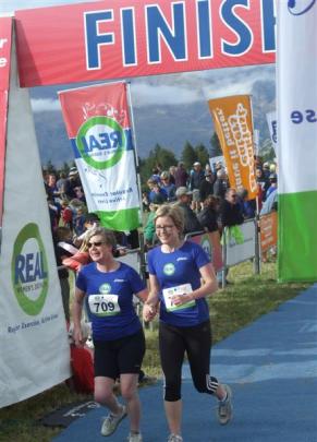 Kate Davis, of Wanaka, and Justine Nicholls, of Alexandra, complete the final running leg to...