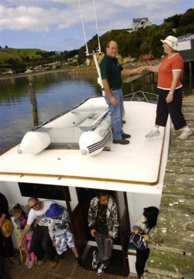 Ann Thornton is helped aboard the Vivienne J water taxi by skipper John McLachlan at Portobello...