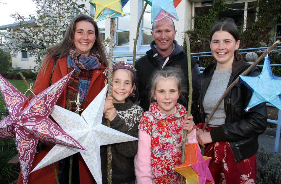 Carrying their handmade star-shaped lanterns in the second annual Lawrence Lantern Festival...