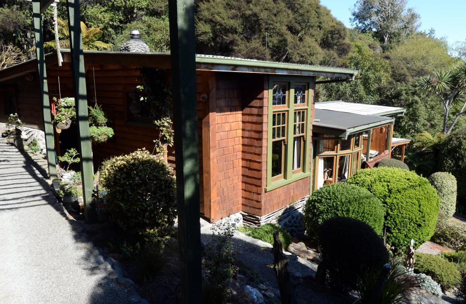 Owners Ian Melvin and Helga Diettrich have added to their 1950s cottage as time and money allowed...