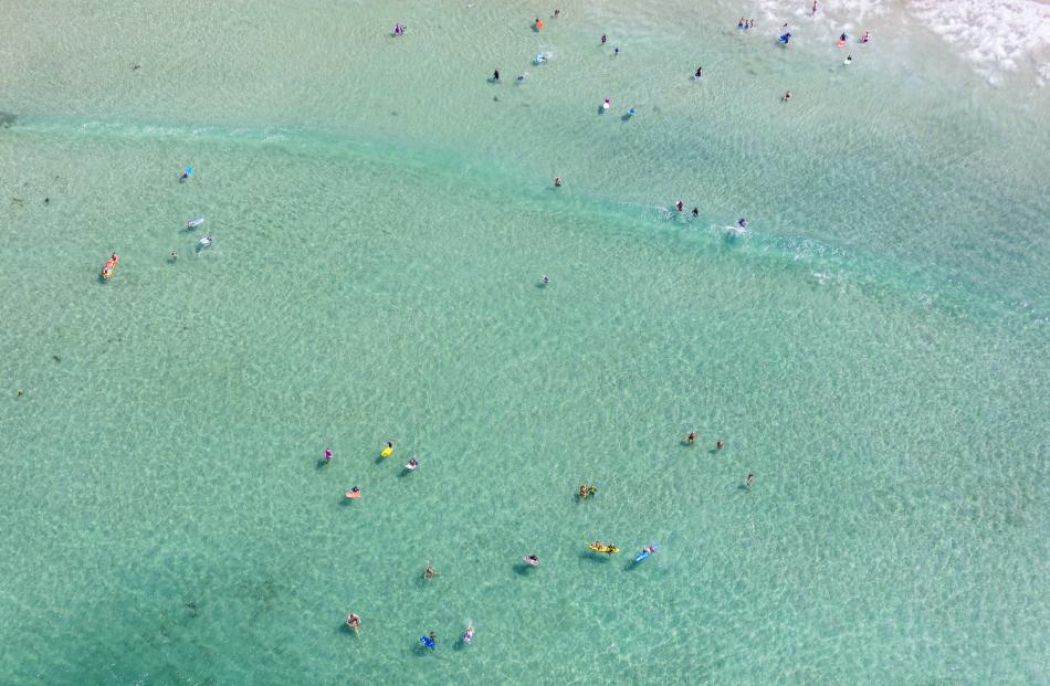 Aerial shot of people enjoying the water at St. Clair, Dunedin. 