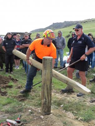 World and national fencing champion Shane Bouskill, of Hawke's Bay, shows some of the fencing skills that have made him a champion, during a Fencing Contractors Association of New Zealand (FCANZ) field day at Earnscleugh Station, near Alexandra. He is hel