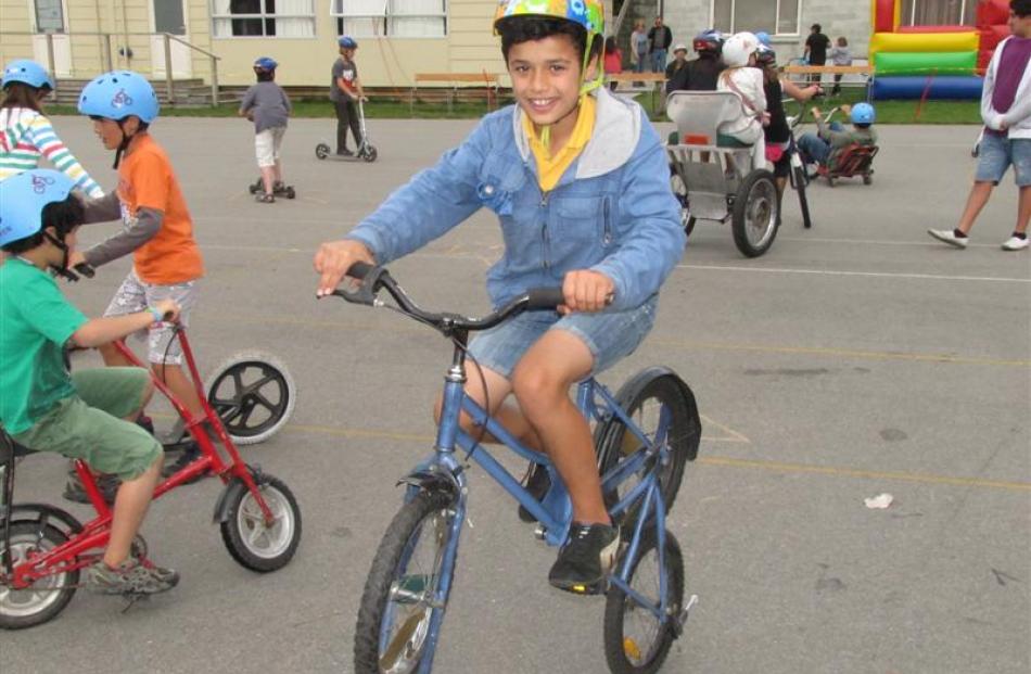 Queenstown Primary School pupil Yasin Tekinkaya (12) masters the art of reverse-pedalling this...