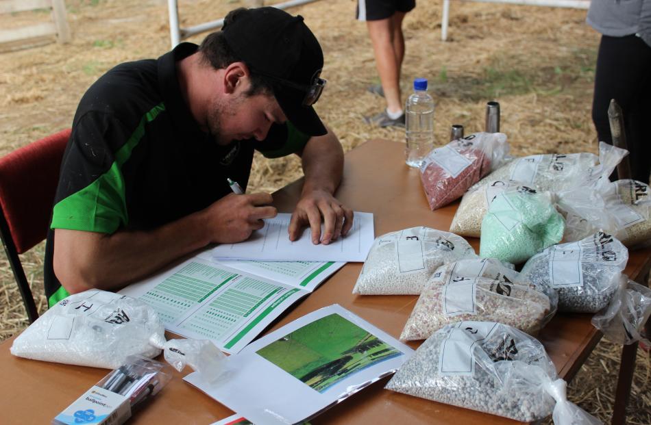 Tom Blackmore, of the Teviot Valley Young Farmers Club, tries to name the different types of fertiliser. He went on to win the Otago district competition.