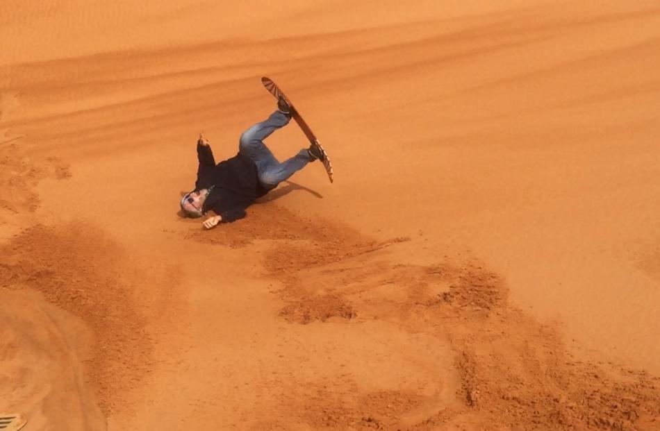Peter Heron Sand boarding on the dunes. Photo: Deborah Heron
