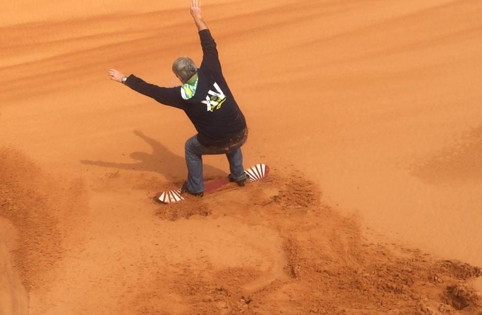 Peter Heron Sand boarding on the dunes. Photo: Deborah Heron