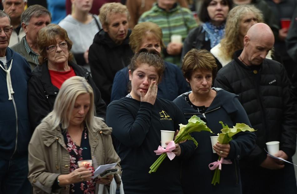 Tearful mourners attend the vigil.