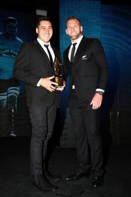 Brett Ranga (left) is presented with the award for Heartland Championship player of the year by...