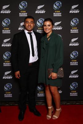 Super Rugby player of the year Richie Mo'unga and fiancee Sophie Vieceli pose on the red carpet. 
