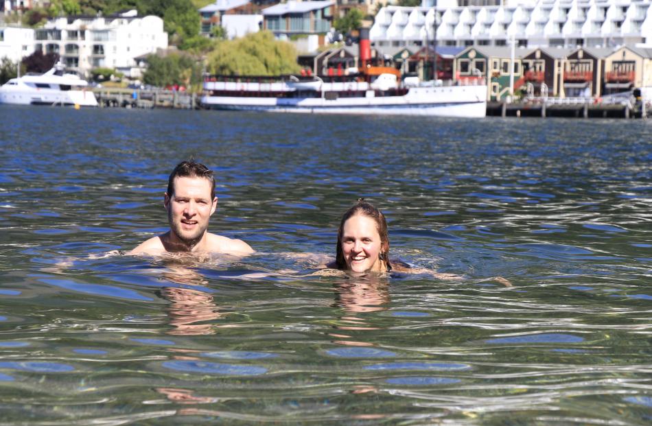 Ali O'Regan and Myles Carey enjoy a dip in Queenstown Bay.